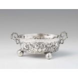 A Hamburg silver wine tasting dishShallow dish on three spherical supports, the surface decorated
