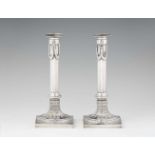 A pair of Mannheim silver candlesticksFluted shafts supported by square plinths. H 26 cm, weight 720