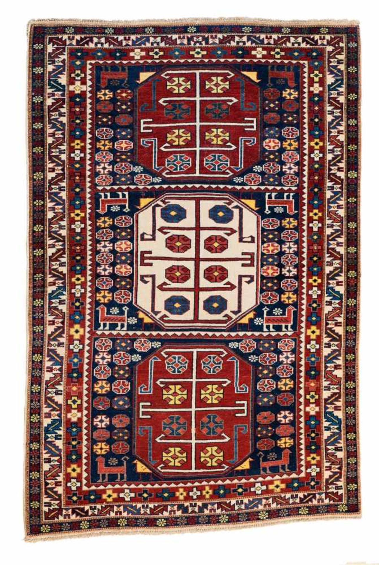 A Caucasian carpetWool. Restored, the borders secured and slightly shortened, soiled. 146 x 98 cm.