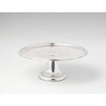 A Spanish silver stembowlRound tray with moulded rim resting on a tapering cylindrical base. H 10.5;