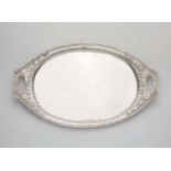 A Neoclassical silver platterOval tray. Pierced rim with acanthus and flowerhead reliefs. L 54; W 33