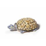 A faience box formed as a turtleWith naturalistically painted removable shell. Unmarked. The tail
