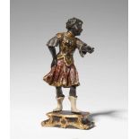 A carved softwood statuette of a Venetian soldierStanding figure of a man in ornate armour,