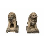 Two sandstone figures of lionsFigures carved in the round on rectangular plinths. The