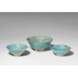 Three Iranian fritware dishes with indented rimsQuarz frit bowls with iridescent turquoise glaze.