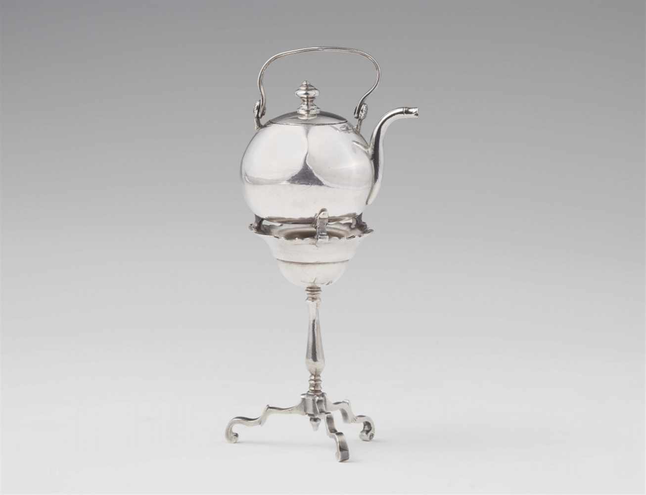 An Amsterdam miniature silver kettle on standTripod stand with tall baluster-form shaft and coal