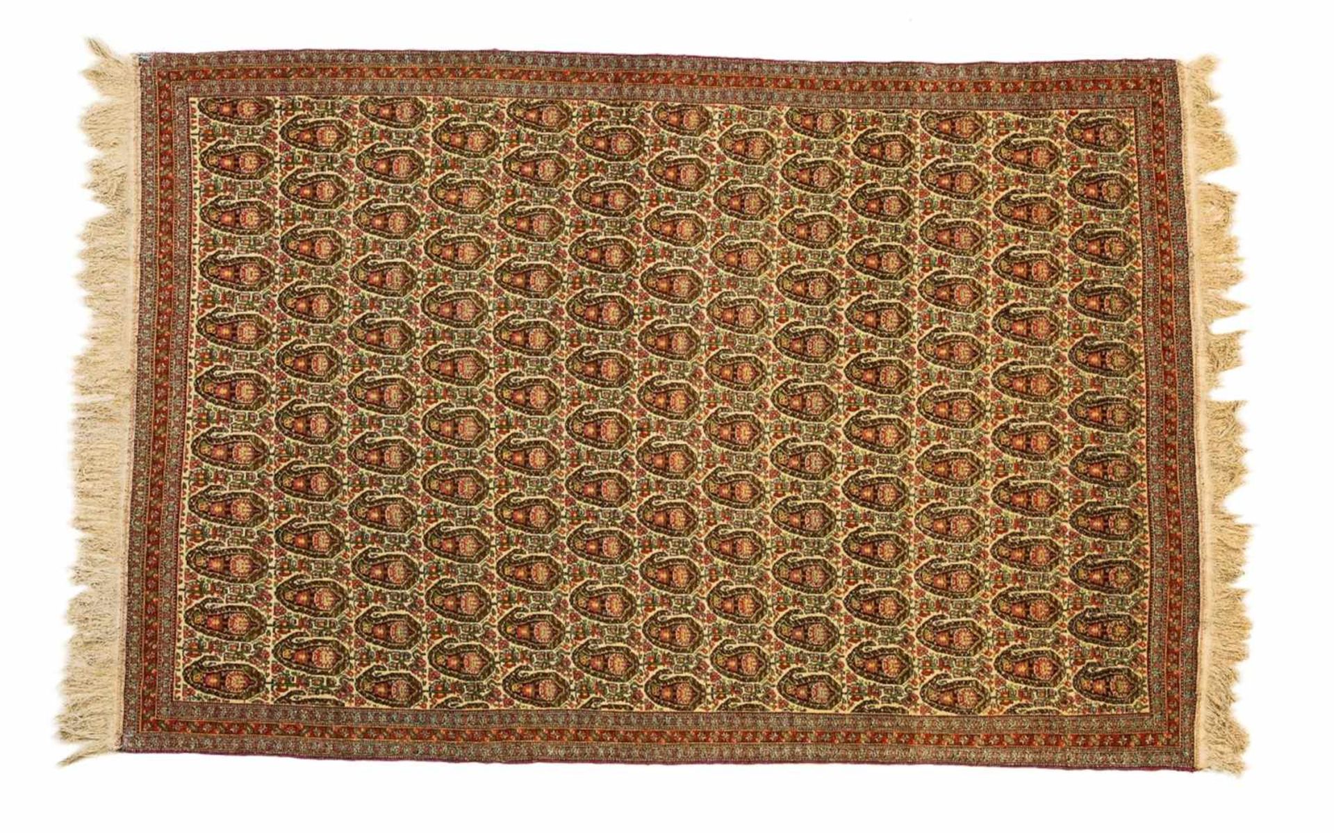 A West Iranian Senneh rugWoll and cotton. With boteh decor on pale ground. 204 x 137 cm.