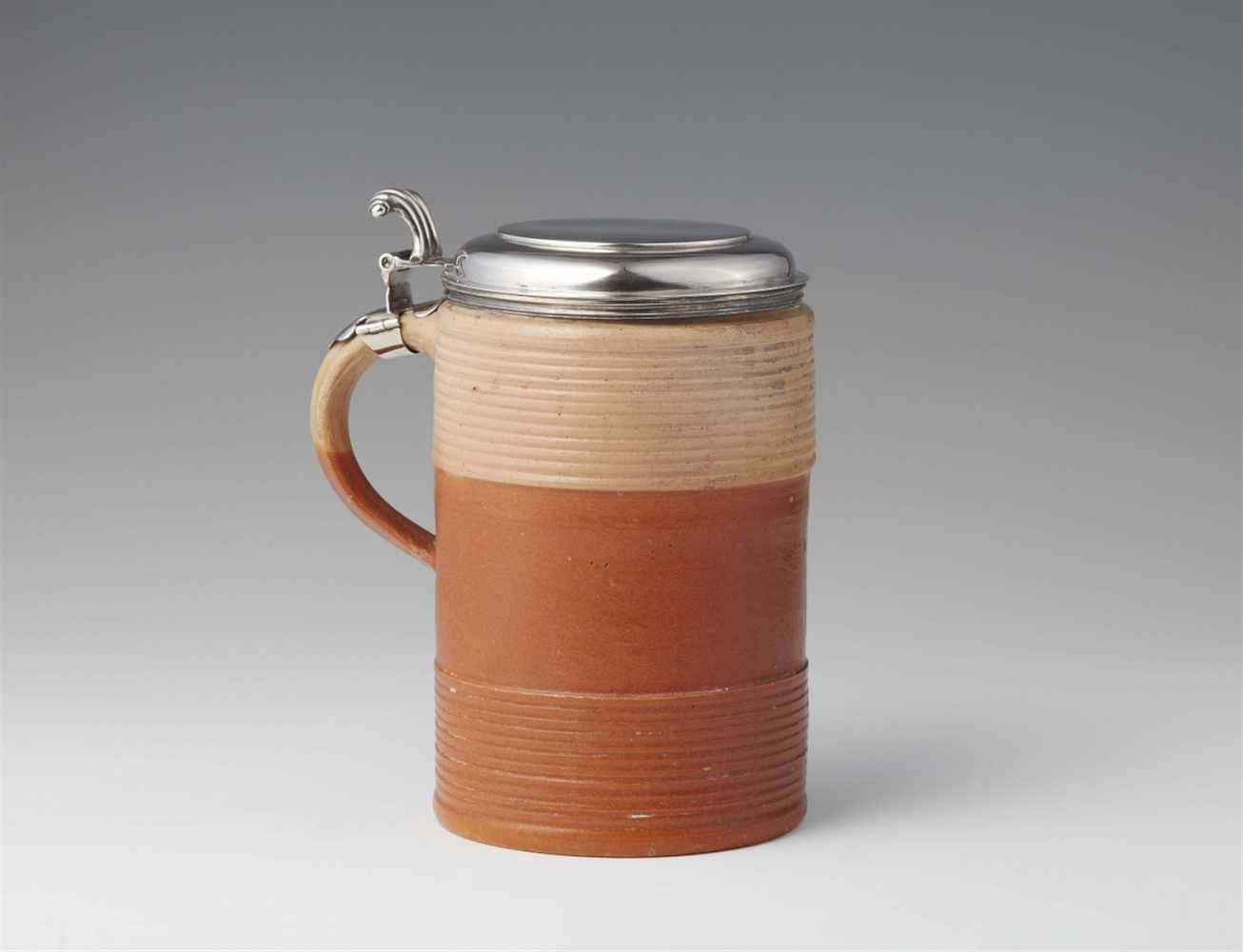 A stoneware "walzenkrug" stein with Amsterdam silver mountingsRibbed stoneware jug with silver