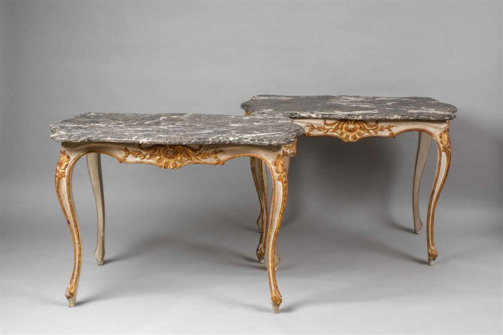 A pair of Rococo style hardwood tablesPainted and gilt carved hardwood with greyish white "grigio