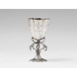 A Dutch miniature silver chaliceLobed base supporting a flaring cuppa engraved with scrollwork and