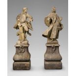 Sandstone models of an elegant couple dancingTwo figures on scrolling plinths, carved in the