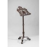 A North Italian wrought iron leggio baroccoLectern with pierced scrollwork reading surface supported