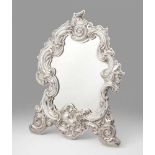 A large silver table mirror made for the Earls of ErneCartouche form relief frame with rich