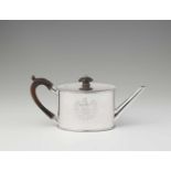 A George III London silver teapotOval tea pot engraved with monogram "IEB" in a cartouche. With