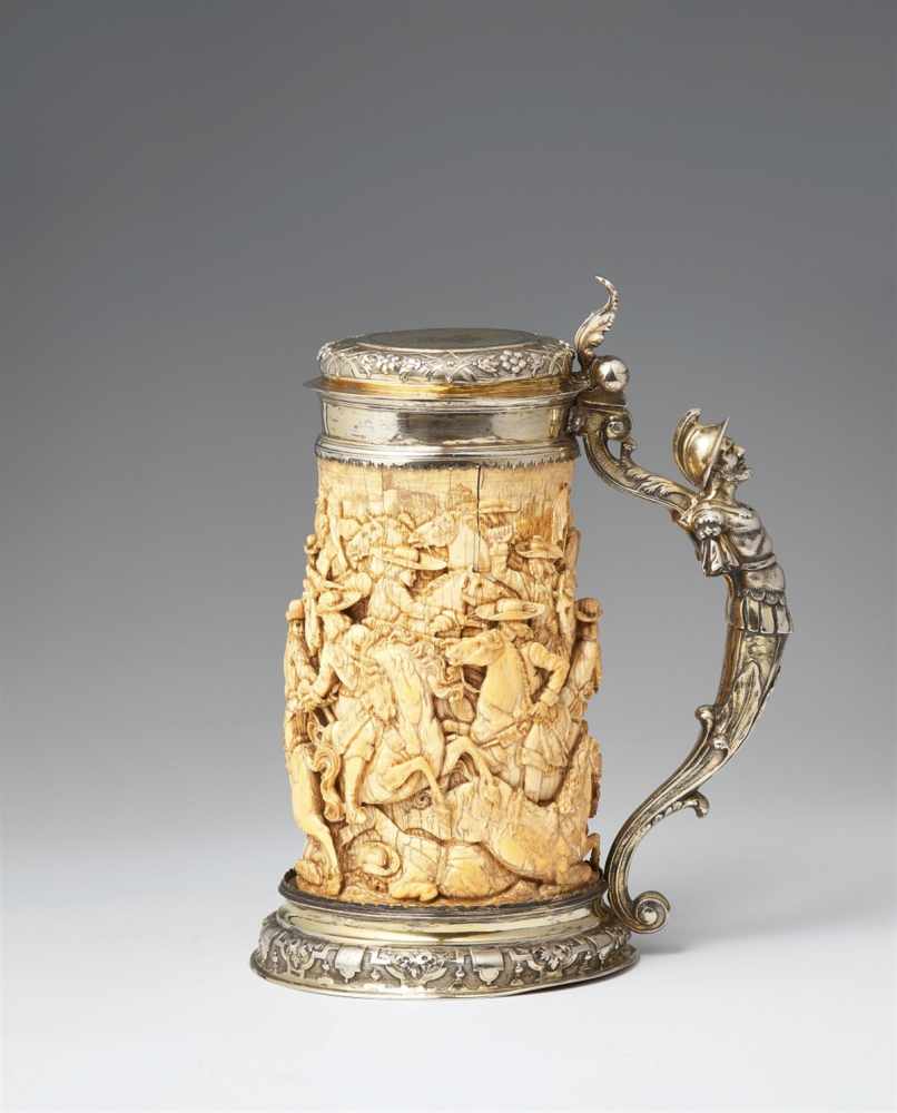 A silver-mounted ivory tankardThe base and domed lid with chased régence decor. The ivory corpus
