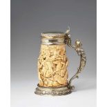 A silver-mounted ivory tankardThe base and domed lid with chased régence decor. The ivory corpus