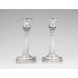 A pair of Weißenfels silver candlesticksTapering fluted shafts resting on square plinths. H 18 cm,
