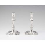 A pair of Riga silver candlesticksSquare scalloped bases surporting baluster form shafts. H 15.5 cm,