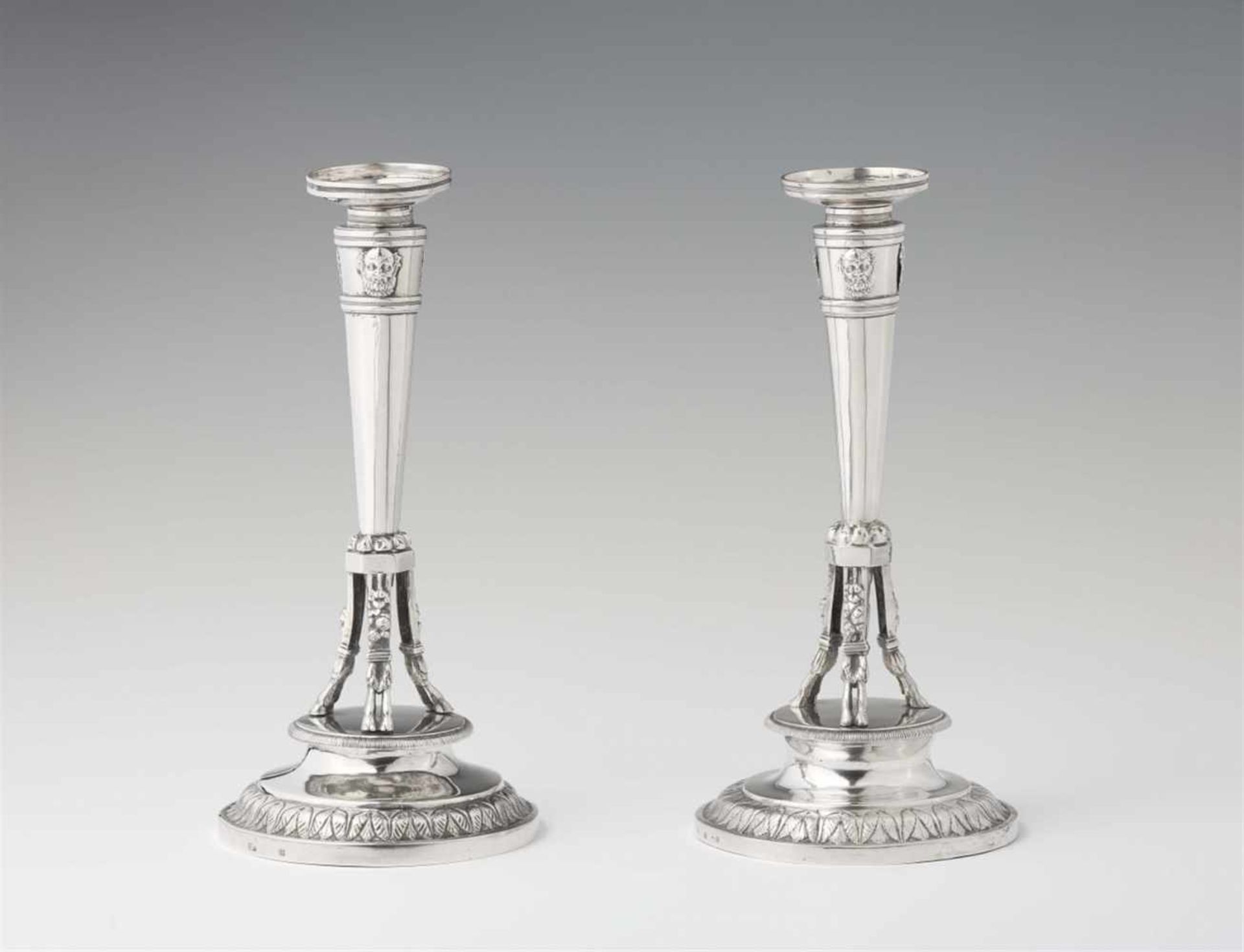 A pair of Empire silver candlesticksColumn shaped candlesticks on hoof feet. H 26 cm, weight 775