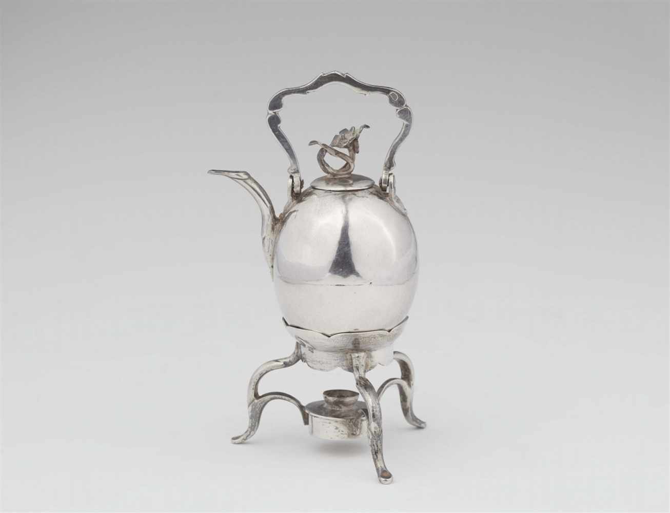 A miniature Amsterdam silver teapot and rechaudOviform teapot with hinged handle and acanthus finial