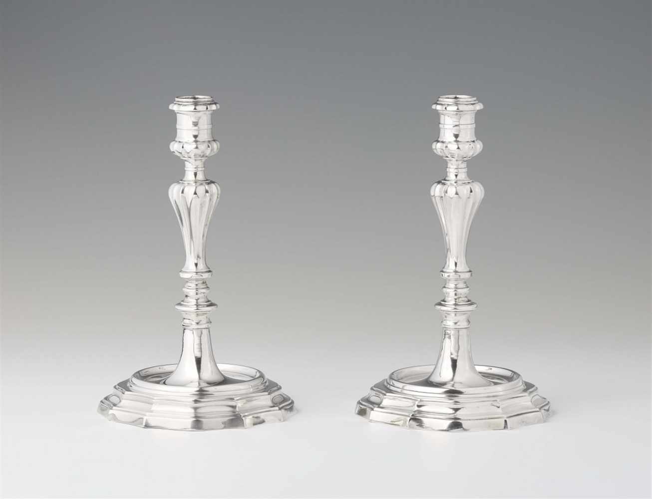 A pair of Florentine Baroque silver candlesticksRound scalloped bases supporting gadrooned