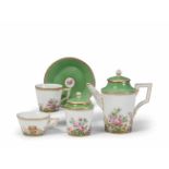 A Berlin KPM porcelain part service with "fleurs en terrasse"Comprising coffee pot, sugar box, two