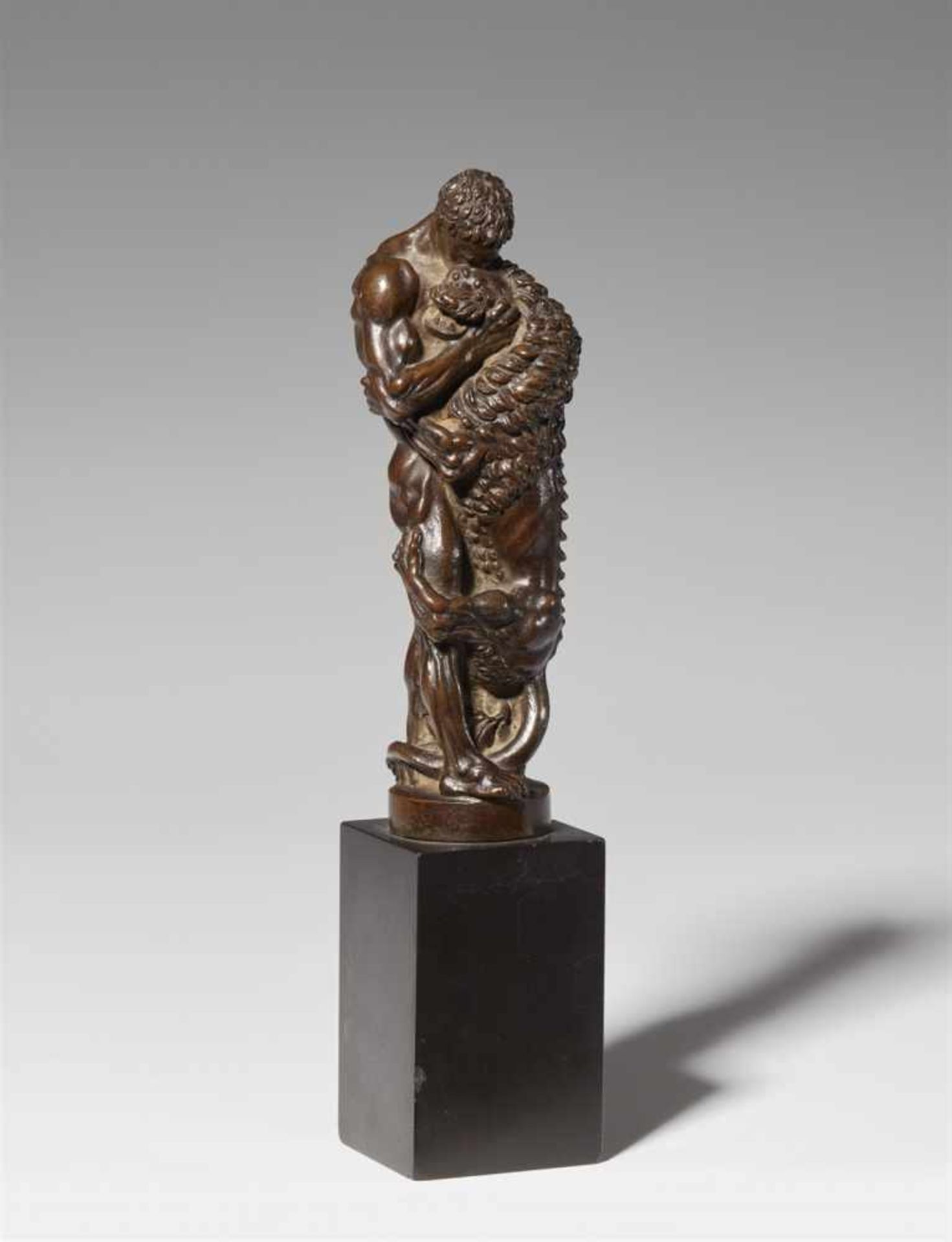 A bronze model of Hercules wrestling the Nemean lionCast bronze with chocolate brown patina on a