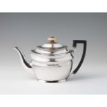 A George III London silver teapotOval tea pot with wooden handle and ivory finial. H 17.5 cm, weight