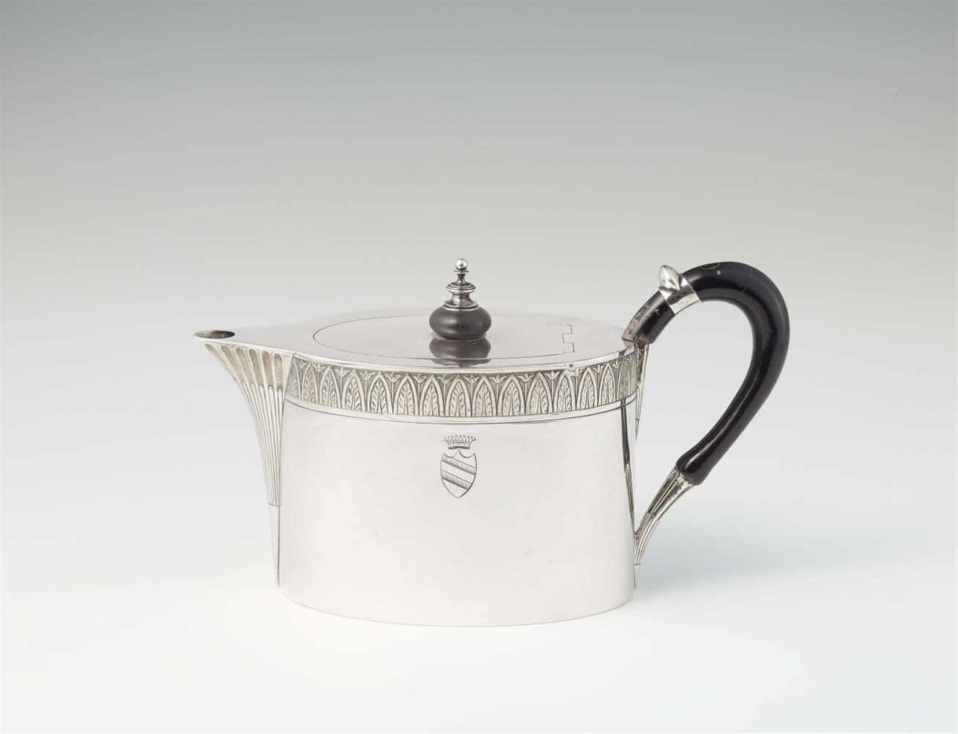 A Dresden silver teapotOval interior gilt vessel with sunken hinged lid. Engraved to the display