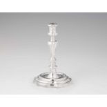 A Florentine silver candlestickRound facetted base supporting a gadrooned baluster form shaft. H