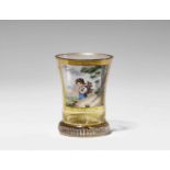 A Vienna glass "ranftbecher" beakerTapering beaker with polychrome enamel and gilding. Decorated