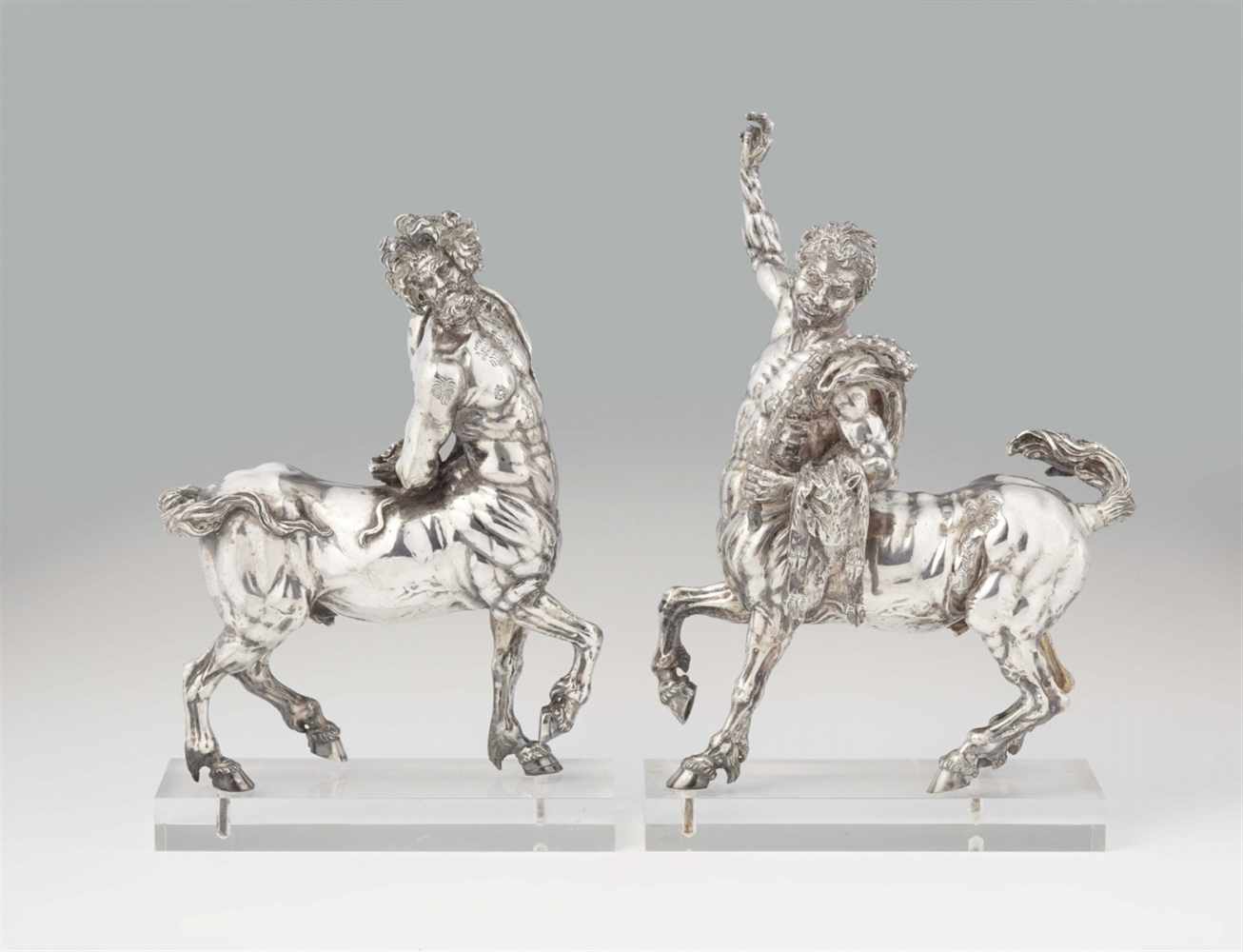 A pair of silver plated metal models of centaursThe "Older Centaur" and "Younger Centaur" modelled