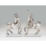 A pair of silver plated metal models of centaursThe "Older Centaur" and "Younger Centaur" modelled