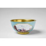 A Meissen porcelain slop bowl with "kauffahrtei" scenesBlue crossed swords mark. Restored over a