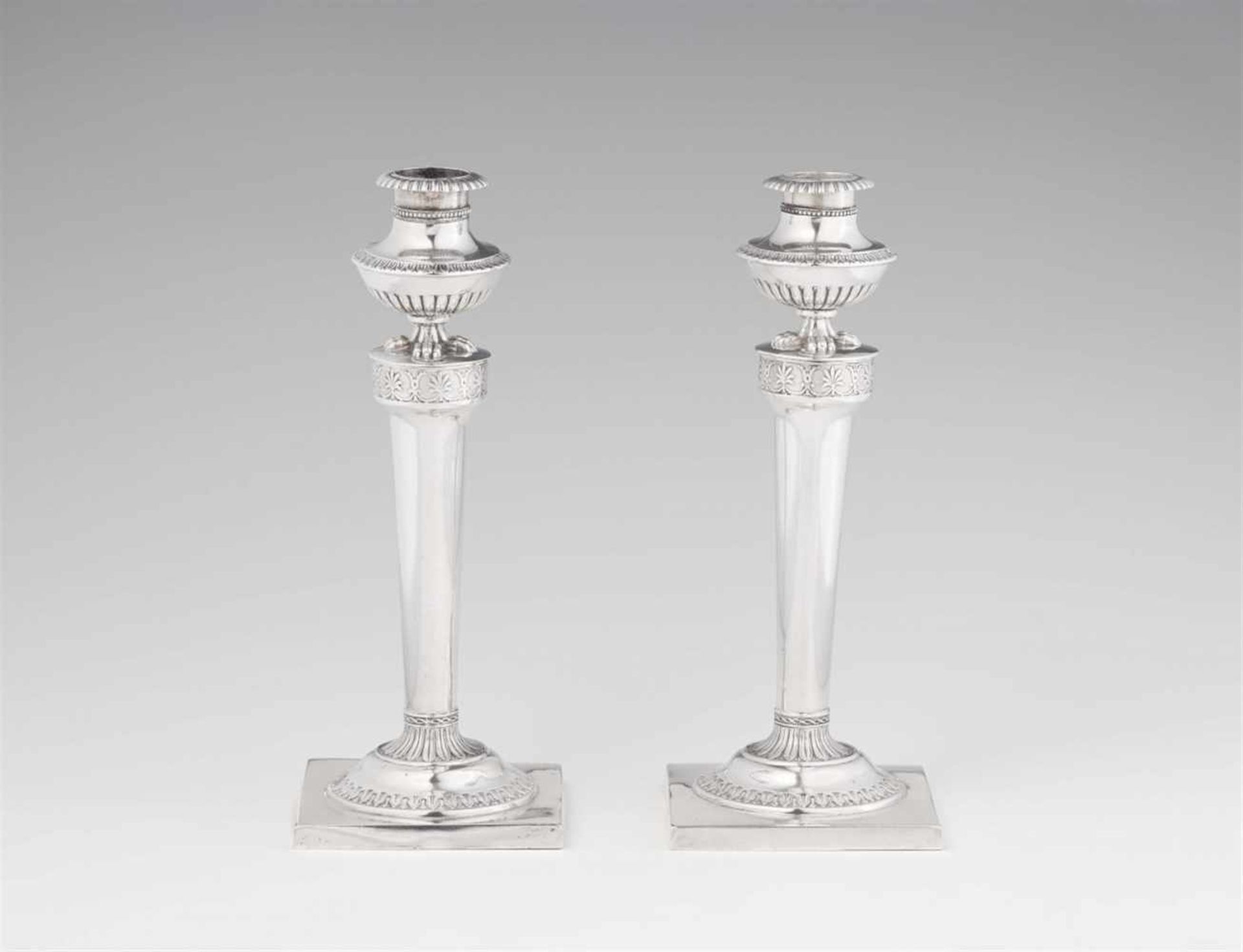 A pair of Hannover silver candlesticksSlightly tapering shafts on square plinths. H 20 cm, weight