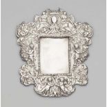 An Augsburg silver votive plaque frameRectangular Baroque cartouche frame with putti and acanthus