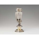 A parcel gilt silver drinking vessel formed as an owlFinely wrought model of a perching bird on a