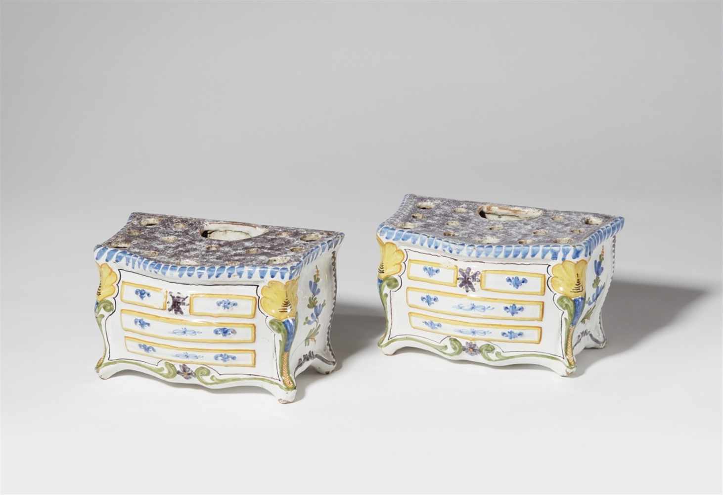 A pair of faience posy vases formed as chests of drawersUnmarked. H 12 and 12.3, L 21, D 12 and 13