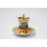 A Berlin KPM porcelain cup with a view of Taxis Castle"Becherform" model with original saucer.