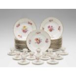 Twenty three Berlin KPM porcelain dinner plates and twelve egg cups with floral decorBlue sceptre