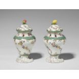 A pair of Meissen porcelain potpourri vases with mosaic bordersOf squat baluster form with