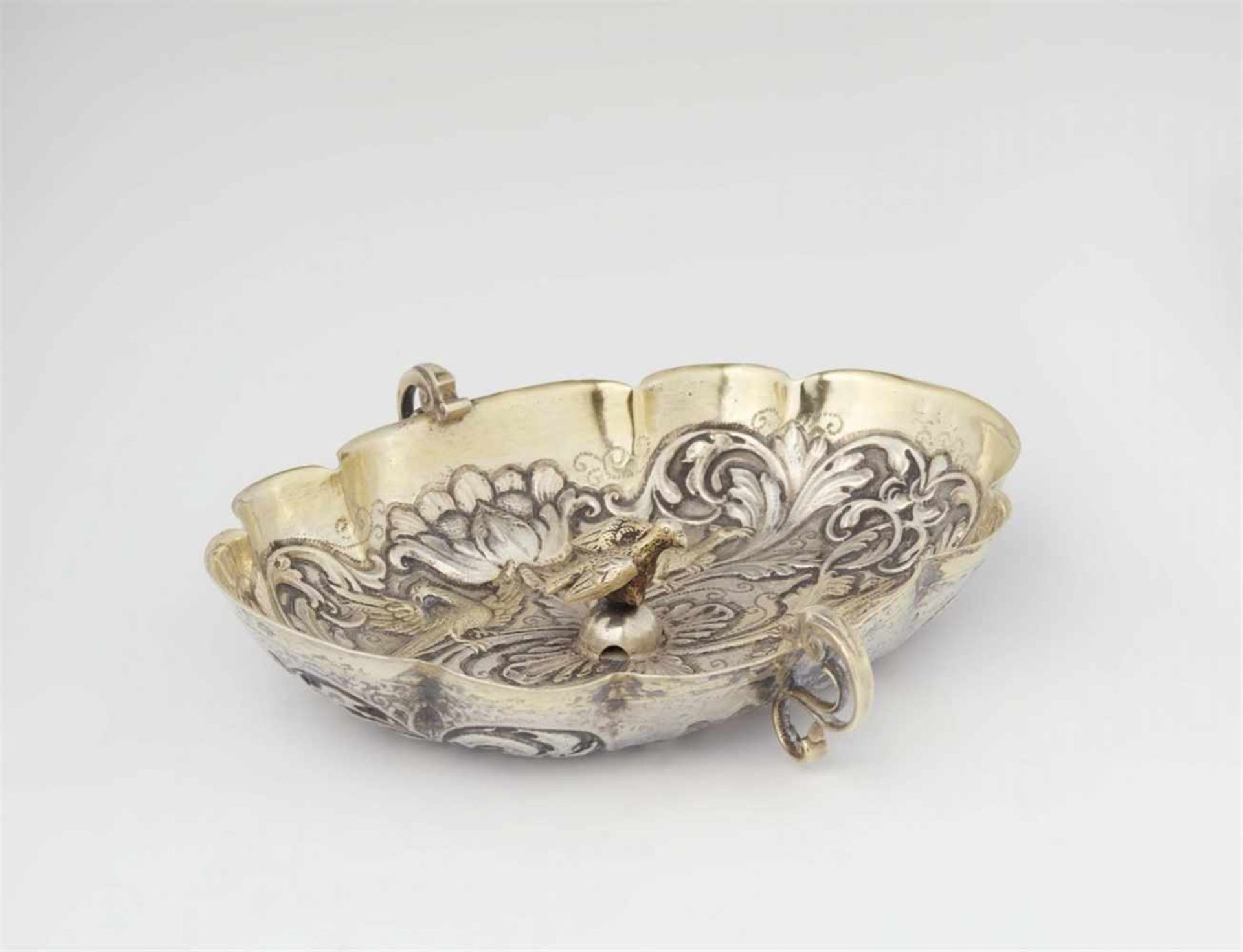 An Augsburg silver gilt brandy bowl with a phoenixOval scalloped dish decorated with an engraved