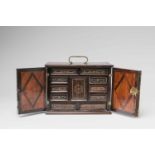A small South German cabinet chestCherry, walnut, palisander, and oak veneer on spruce; brass and