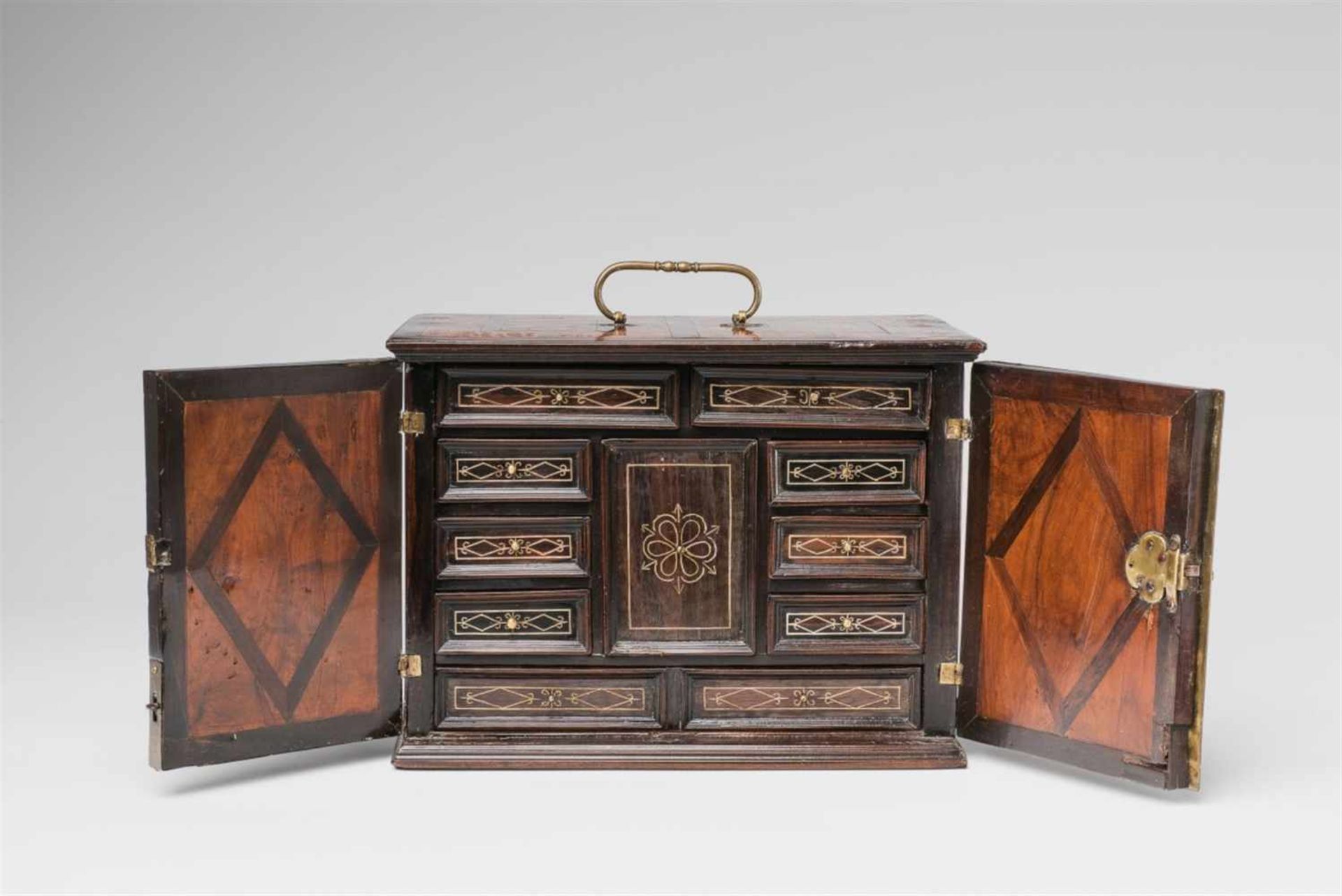 A small South German cabinet chestCherry, walnut, palisander, and oak veneer on spruce; brass and