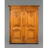 An Aachen carved oak cabinetCorpus with two doors and rounded edges. The pilasters and architrave