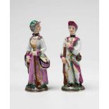 A pair of Ludwigsburg porcelain perfume bottles formed as huntersVermeil mountings. Small, finely