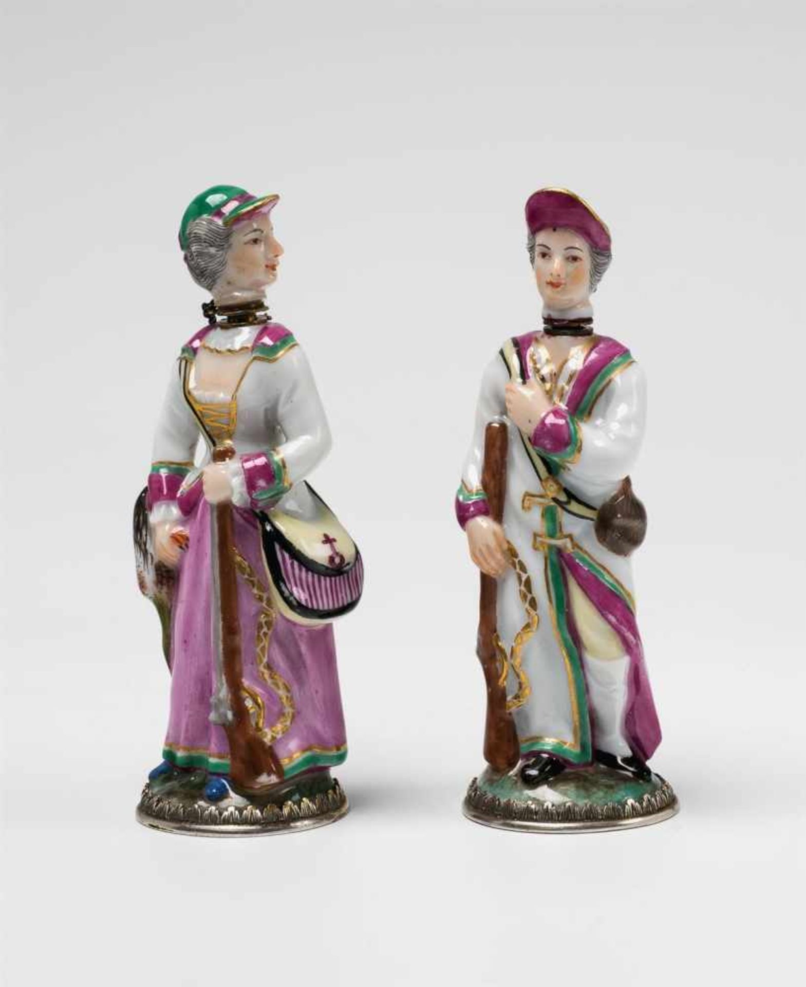 A pair of Ludwigsburg porcelain perfume bottles formed as huntersVermeil mountings. Small, finely