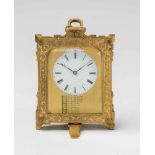 A Vienna travel clock with a calendarEngraved brass, white enamel dial, facetted glass. Day-