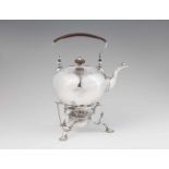 A George II silver tea kettle on rechaudRounded tea kettle with recessed hinged lid and hinged