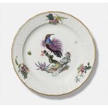 A Meissen porcelain platter with a bird of paradisePainted to the centre with an exotic bird